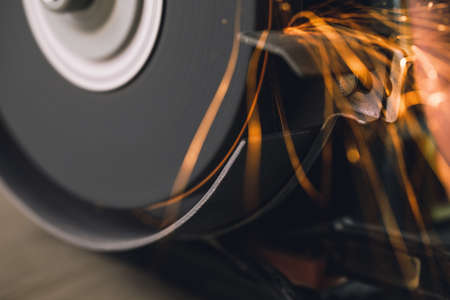 Close-up of bench grinder machine in workshopの写真素材