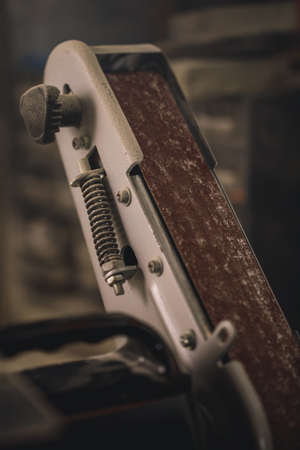 Polishing machine with a sandpaper in workshopの写真素材