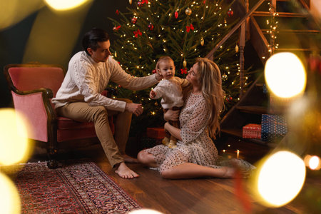 Young happy family are celebrating Christmas or New year.