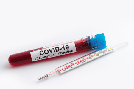 Close-up of the blood sample and thermometer