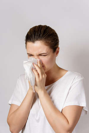 Young woman with a runny nose symptomの写真素材