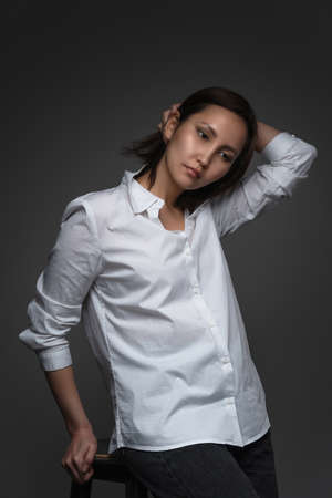Beautiful asian model wearing oversize white shirtの写真素材