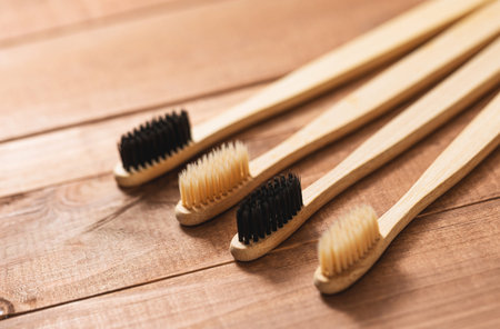 Eco bamboo toothbrushes on the wooden surface