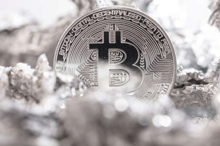 Close up of bitcoin on the foil surfaceの写真素材