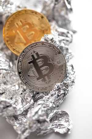 Close up of bitcoin on the foil surfaceの写真素材