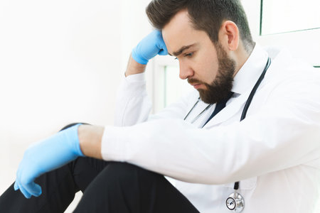 Exhausted doctor after long shift in the hospital