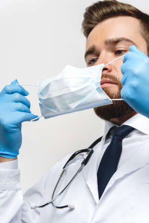 Doctor is wearing prevention mask against virus spreadingの写真素材