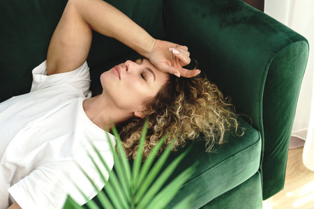 Young beautiful woman with a curly hair and smooth hair