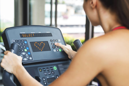 Fitness workout on stationary bike in the gym