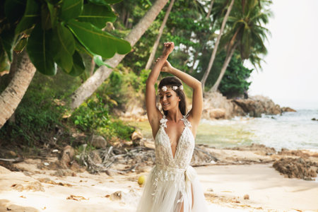 Sensual bride wearing beautiful wedding dress on the tropical islandの写真素材