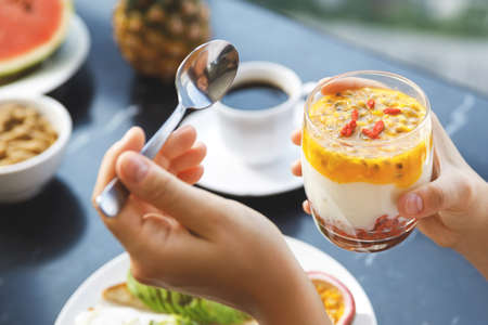 Fresh low fat and lactose free yogurt with a Goji berries and juice of passion fruitの写真素材