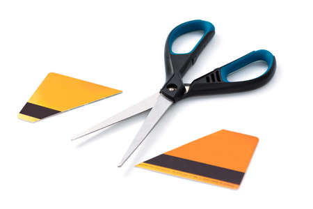 Scissors and cut credit card on whiteの写真素材