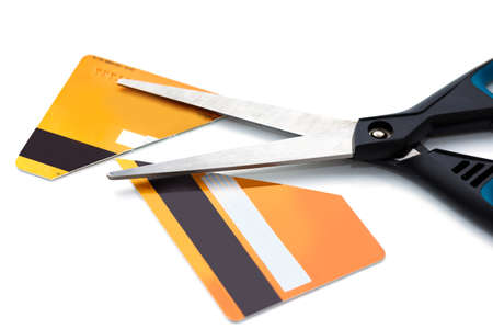 Scissors and cut credit card on whiteの写真素材