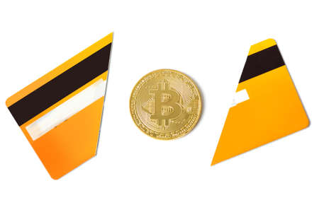 Bitcoin and broken credit card on white backgroundの写真素材