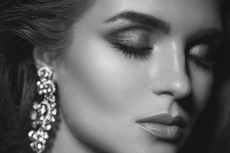 Gorgeous woman with a beautiful make-up in studioの写真素材