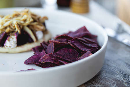 Very tasty beetroot veggie chips and guacamoleの写真素材