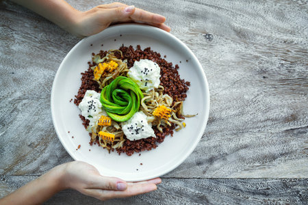Delicious dish with Avocado, cheese, corn and sprouted wheat grains.
