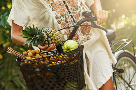 Basket on the bicycle full of different exotic fruitsの写真素材