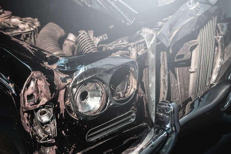 Close up of retro automobile front part after car crashの写真素材