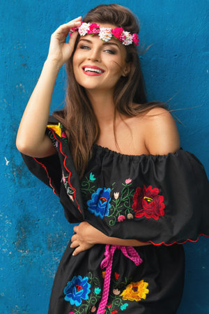 Young beautiful woman wearing traditional mexican dress