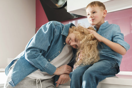 Happy mother and her cute son at home