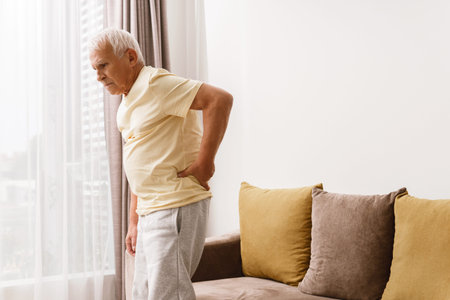Senior man is suffering from pain in lower back