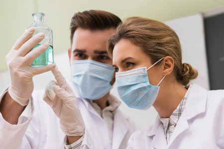 Scientist colleagues is working with a chemical reagents in a laboratory during researchの写真素材