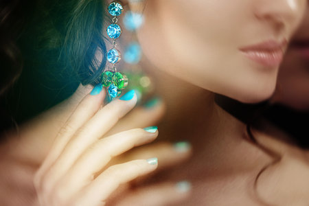 Woman is wearing beautiful and expensive earringsの写真素材