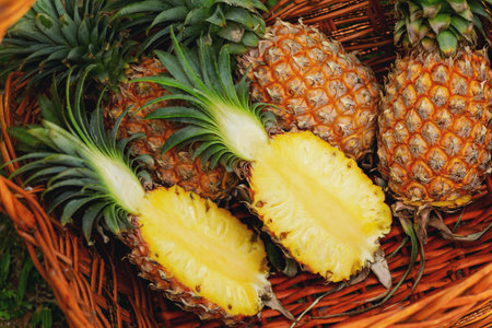 Closeup of basket full of fresh ripe pineapples