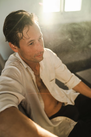 Portrait of handsome thoughtful man with wet hairの写真素材