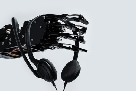 Real robots hand with headset. Concept of Artificial intelligence and Chatbots usage in online...
