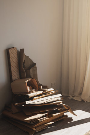 Stack of Cardboard Waste at home. Concepts of Paper Recycling and Waste Sortingの写真素材