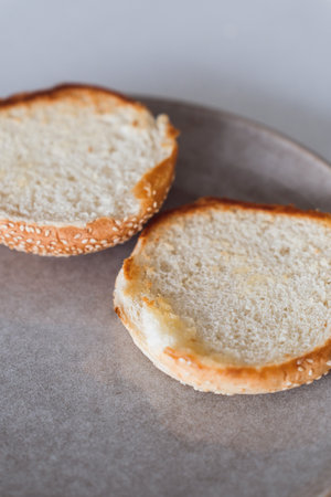 Closeup view of grilled burger buns placed neatly on a plateの写真素材