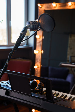 Piano, microphone and mirror in an empty studioの写真素材