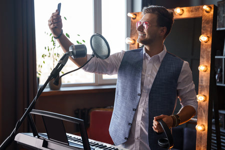 Young musician is taking a selfie in a studio