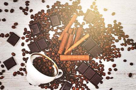 Roasted coffee beans, cinnamon sticks and dark chocolate