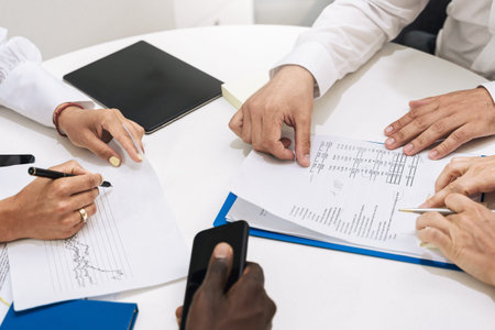 Business people during meeting working at the round table