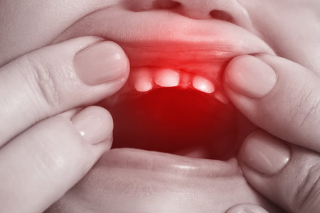 Baby suffering from painful teething symptoms