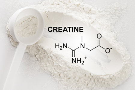 Scoop of creatine monohydrate supplement and chemical formulaの写真素材