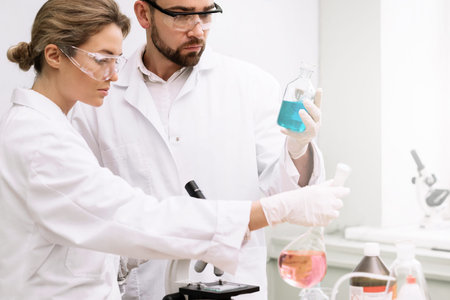Two students are working in a laboratory during science research work