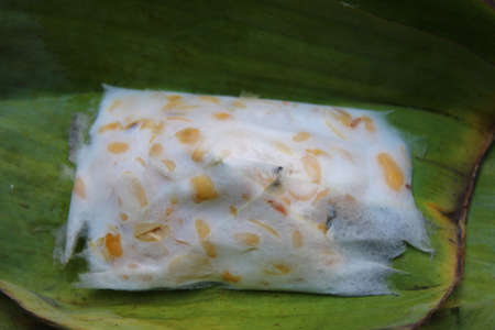 View of tempeh with banana tree leaves against a stone backgroundの写真素材