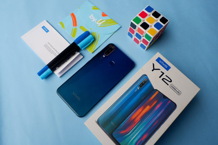 August 3, 2020, photo of a smartphone with a cardboard box and cell phone card, Indonesia
