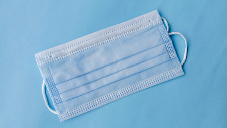 Photo of a medical mask, on a light blue background