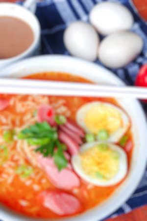 blur photo of noodle soup with hot and spicy sauceの写真素材