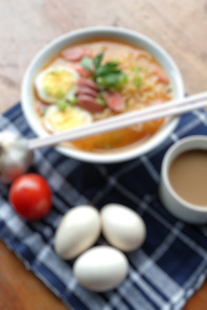 blur photo of noodle soup with hot and spicy sauce