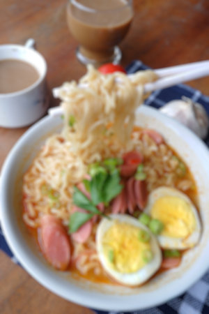 blur photo of noodle soup with hot and spicy sauceの写真素材