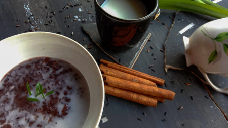 photo of food in the form of black sticky rice with milkの写真素材