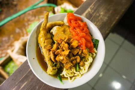 Stock photo of fresh homemade chicken soup with noodles at table. Black backgroundの写真素材