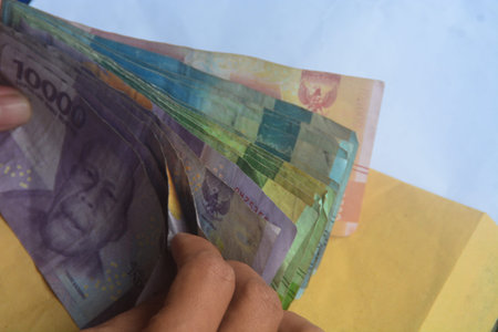 looks at the means of payment in Indonesia. Indonesian money is called rupiah. used as legal tender....