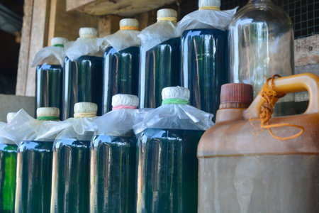 Gasoline sold in retail uses liter bottles.の写真素材